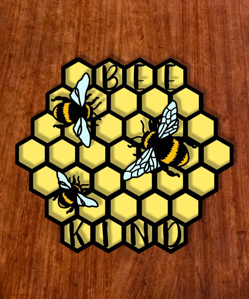 May include: A honeycomb design with three bees and the words "BE KIND" in black lettering. The honeycomb is yellow and black, and the bees are yellow and black with light blue wings.