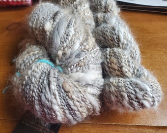 Handspun Satin angora yarn, spiral plied thick and thin