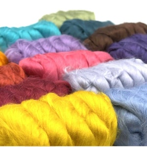 May include: A collection of colorful wool roving in various shades, including yellow, red, blue, green, and purple. The wool is arranged in a row, with each color separated from the next.