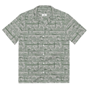 May include: A short-sleeved button-down shirt with a gray background and a repeating green line drawing pattern. The pattern includes clouds, buildings, and other landscape elements. The shirt has a camp collar and white buttons.