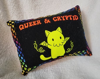 Queer and Cryptid Pillows