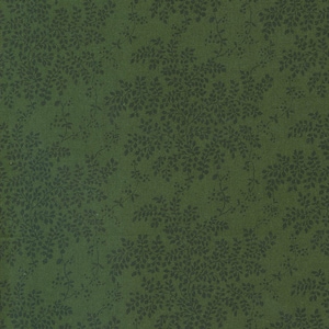 Op de afbeelding: Een groene stof met een donkergroen bloemenpatroon. De stof heeft een subtiele textuur.