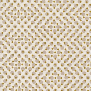 Op de afbeelding: Een witte stof met een herhalend patroon van kleine en grote gouden en bruine cirkels.