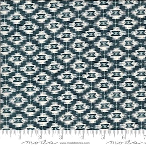 May include: Teal and white fabric with a geometric pattern. The fabric has a repeating pattern of small white diamonds with a teal dot in the centre. The fabric is woven and has a soft texture.