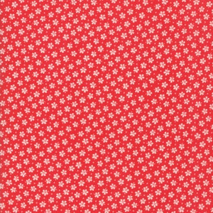 May include: Red fabric with a repeating pattern of small white flowers and dots. The floral design is evenly spaced across the fabric, creating a consistent and visually appealing texture. This fabric is suitable for various sewing and crafting projects.