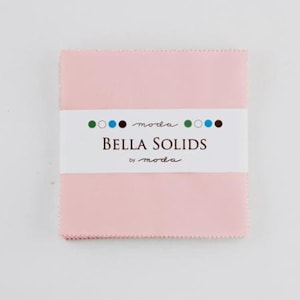 May include: A pack of pink fabric squares with the text "moda Bella Solids by moda" on the label.