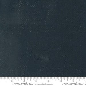 May include: A dark blue fabric with a subtle white speckled pattern. The fabric is textured and has a slight sheen. The fabric is marked with "moda" and a website address.