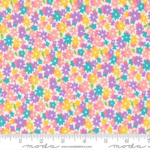 May include: White fabric with a small-scale floral print in shades of pink, yellow, purple, and teal.