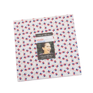 May include: Moda Fabrics Holiday Essentials Americana Story Jet  by  Story  Jet  Hu fabric featuring a white background with small red, white, and blue American flags.