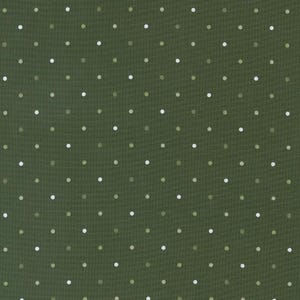 May include: A green fabric with a white polka dot pattern.