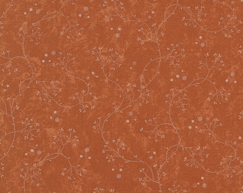 May include: A brown fabric with a white floral pattern. The pattern features small white dots and delicate white branches with leaves.
