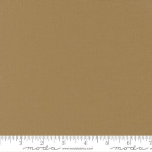 May include: A solid brown fabric with a subtle woven texture. The fabric is shown with a ruler for scale.