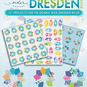 May include: Book cover with the title "The Double Wide Dresden Book" and the subtitle "13+ Projects for the Double Wide Dresden Ruler". The cover features colourful quilt blocks in a Dresden pattern.