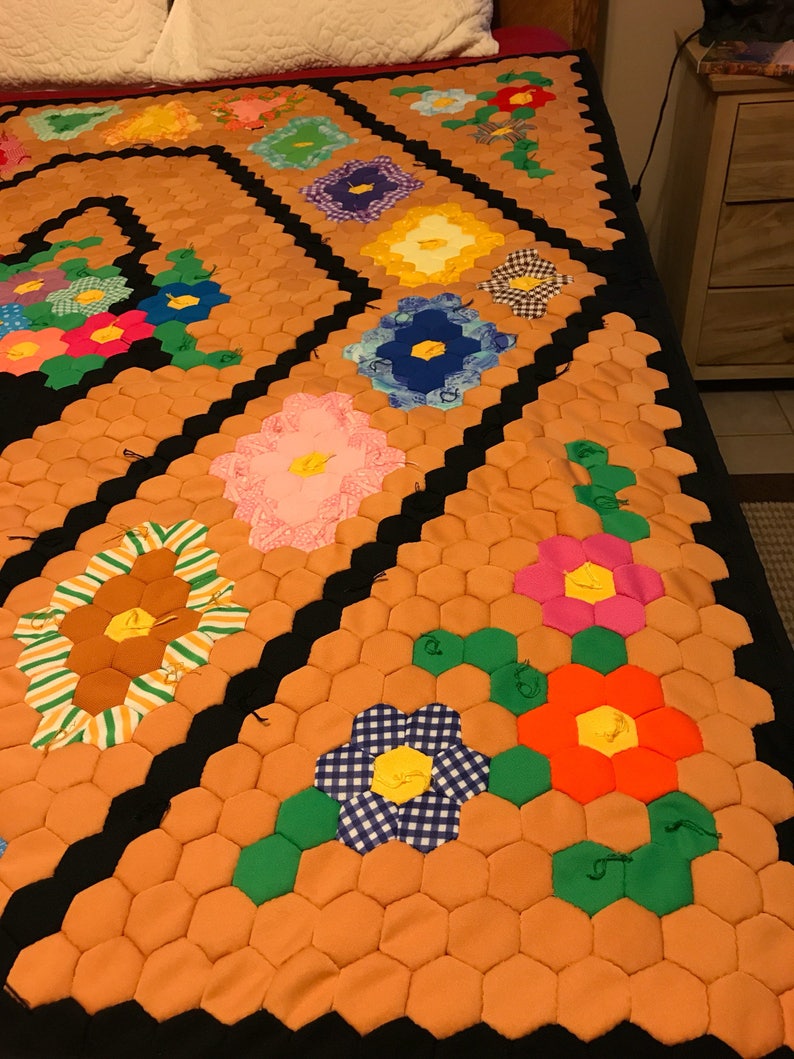 Vintage polyester flower basketgarden quilt top newly quilted with cotton batting and backing lap size 53 wide and 63 long