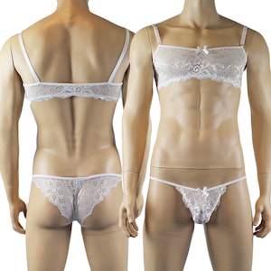 May include: White lace lingerie set, including a bralette with adjustable straps, a thong, and a matching brief. The bralette features a small bow detail. The set is displayed on a mannequin.