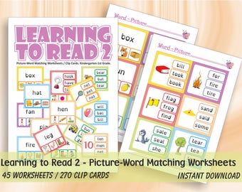 Puede incluir: Hojas de trabajo educativas tituladas "Learning to Read 2" con ejercicios de emparejamiento de palabras e imágenes. Las hojas de trabajo presentan ilustraciones coloridas y palabras como "box", "hat" y "fire". El texto también menciona "45 hojas de trabajo / 270 tarjetas de clip".