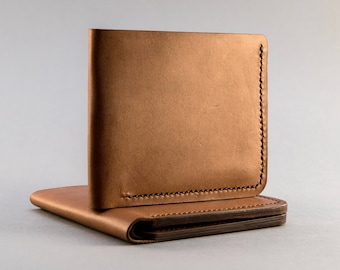 Bifold leather wallet for cards and bills made of vegetable tanned Italian leather with 6 card slots and compartment for bills