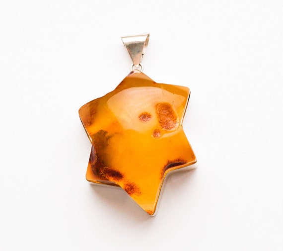73g. Baltic amber pendant star