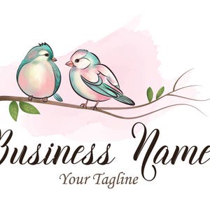 May include: A watercolor illustration of two blue and pink birds perched on a branch with green leaves. The birds are facing each other and the background is a soft pink watercolor wash. The text "Business Name" and "Your Tagline" is written below the birds.
