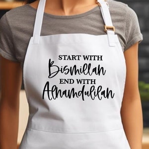 May include: White kitchen apron with black text that reads "Start with Bismillah End with Alhamdulillah".
