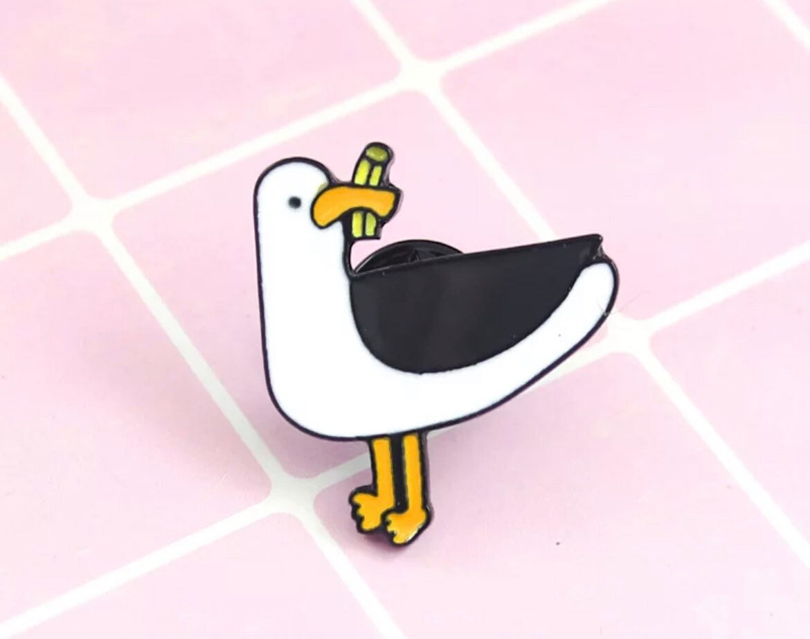 Enamel Badge - Lapel Pin - Bag Charm Brooch - Cartoon Seagull Eating Chips - 80's Nostalgia - Gift Idea - Free UK P&P Enamel Badge - Lapel Pin - Bag Charm Brooch - Cartoon Seagull Eating Chips - 80's Nostalgia - Gift Idea - Free UK P&P