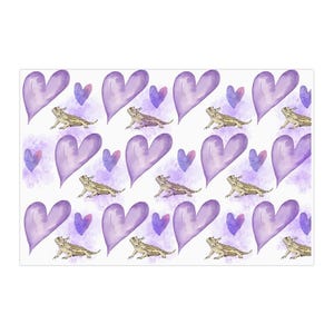May include: A seamless pattern featuring purple watercolor hearts and cartoon bearded dragons. The hearts are outlined in a darker purple and have a watercolor effect. The bearded dragons are drawn in a cartoon style and are facing to the right. The background is white.