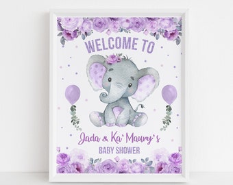 Puede incluir: Un cartel de bienvenida para una baby shower de color morado y gris con un borde floral y un elefante de dibujos animados que lleva una corona de flores. El cartel dice "Bienvenido a Jada & Ka' Maurry's Baby Shower".