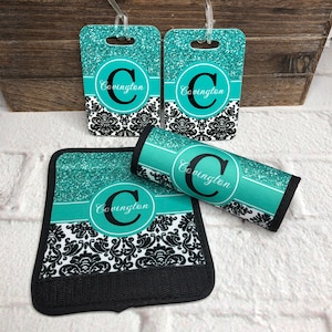 May include: Set of four luggage tags and a luggage strap featuring a teal glitter background with a black and white damask pattern. The luggage tags and strap are personalized with the letter "C" and the name "Covington".