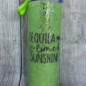 May include: Green glitter tumbler with a black design that says "Tequila Lime & Sunshine".