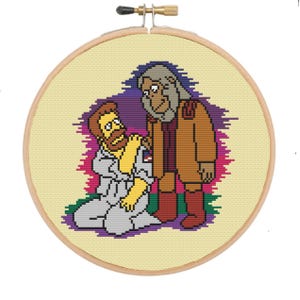 May include: Cross-stitch embroidery hoop featuring a cartoon image of two characters. One character is a yellow-skinned man with a beard and a blue shirt, kneeling and holding a hand out to a tall, gray-haired character with a brown coat and red boots.