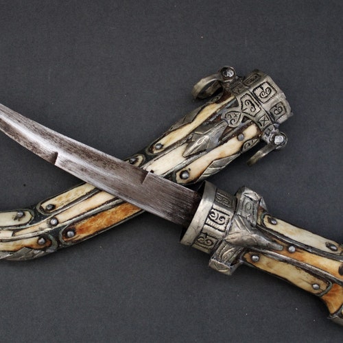 Vintage Ceremonial North African / MOROCCAN DAGGER from the Sahara. Bone shops covered with engraved metal embellishment. Berber / Berbere.
