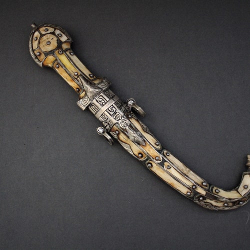 Vintage Ceremonial North African / MOROCCAN DAGGER from the Sahara. Bone shops covered with engraved metal embellishment. Berber / Berbere.