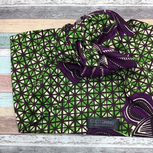 May include: Green and purple fabric with a geometric pattern. The fabric has a tag that says "Cucitorino Be yourself love yourself".