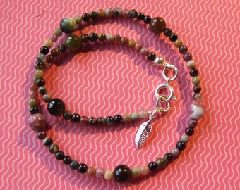 A double wrap Brazilian Tourmaline bracelet with 925 sterling silver feather charm..