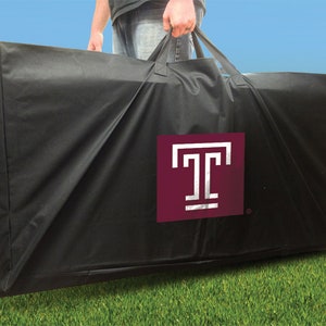 May include: Black carrying case with a maroon square logo featuring a white "T" inside. The case has two handles.