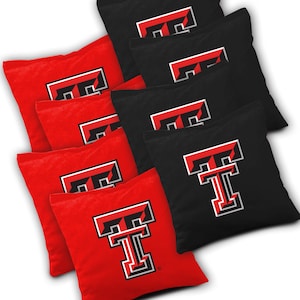 May include: Set of 8 red and black bean bags with a Texas Tech University logo. The bean bags are made of a soft, durable fabric and are perfect for playing cornhole or other bean bag games.