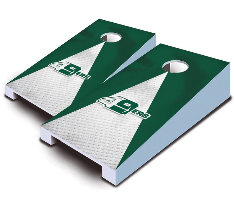 May include: Two green and white cornhole boards with the San Francisco 49ers logo. The boards are made of wood and have a white base.