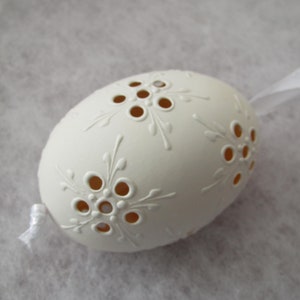 Easter decoration, real egg, duck egg, white, perforated, decorated with white wax, with holes