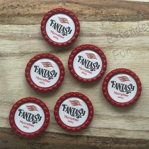 May include: Six red bottle caps with a white center featuring the word "FANTASY" in a stylized font, along with "Merrytime 2025". Each cap has a decorative red edge and a graphic of a flag.