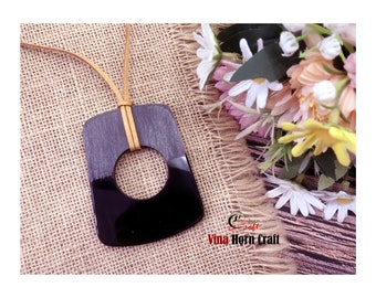 Buffalo Horn Pendants Natural - black pendant with scratches