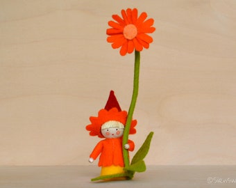 Marigold gnome handmade out of wool felt and wool. Waldorf inspired for on the nature table.