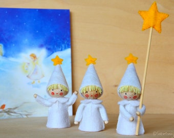 Three little light carrier gnomes with star made of wool felt, Waldorf inspired for on the nature table.