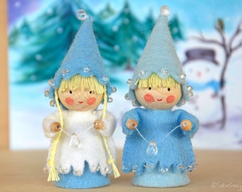Two little winter gnomes with ice drop made of wool felt, Waldorf inspired for on the nature table.