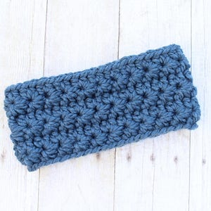 May include: A blue crocheted headband with a textured, puffy stitch pattern.