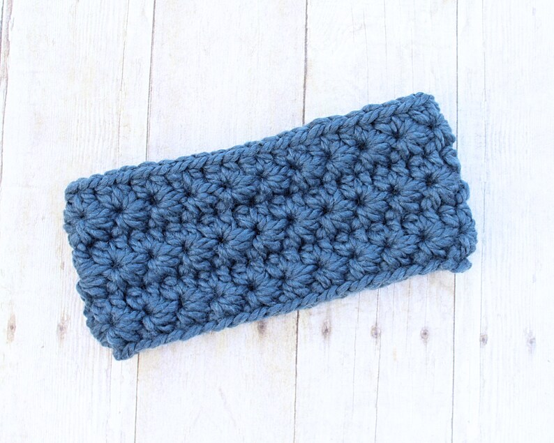 May include: A blue crocheted headband with a textured, puffy stitch pattern.