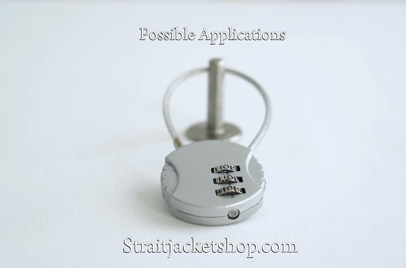May include: A silver combination lock with a cable attached. The lock has three dials with numbers on them. The text "Possible Applications" is visible above the lock.