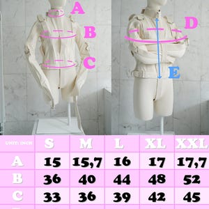 May include: A size chart for a white, long-sleeved garment with straps. The chart shows measurements in inches for sizes S, M, L, XL, and XXL. The measurements are labelled A, B, C, D, and E.