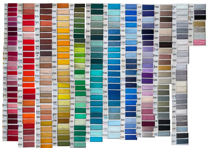 May include: A comprehensive color chart featuring numerous small, rectangular swatches of embroidery thread arranged in vertical columns. Each swatch is labeled with a unique alphanumeric code, displaying a full spectrum of colors including reds, yellows, greens, blues, purples, browns, grays, and blacks.