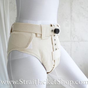 May include: A white adult diaper with a white belt and a black buckle. The diaper has a flap that covers the front and snaps closed.