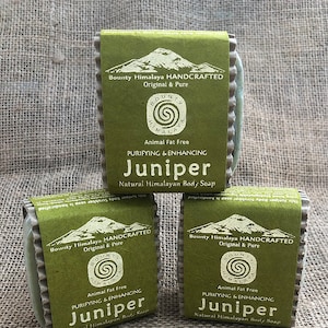 May include: Three bars of green soap with white labels. The labels read "Bounty Himalaya Handcrafted Original & Pure" and "Animal Fat Free Purifying & Enhancing Juniper Natural Himalayan Body Soap".